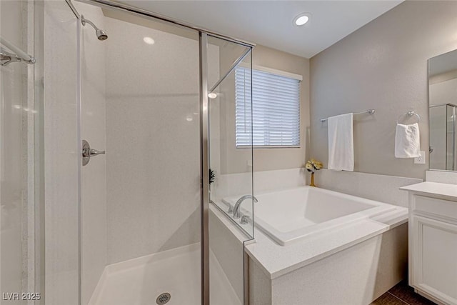 bathroom with vanity and plus walk in shower