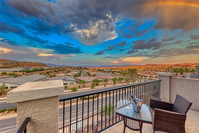 balcony at dusk with a mountain view