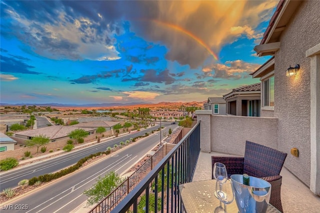 view of balcony at dusk