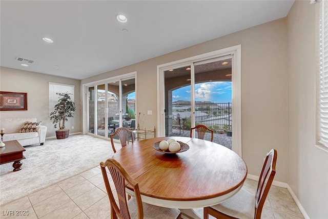 dining area featuring light tile patterned floors