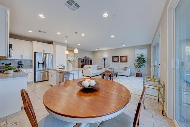 tiled dining space with sink