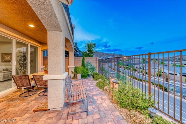 view of patio / terrace featuring a mountain view