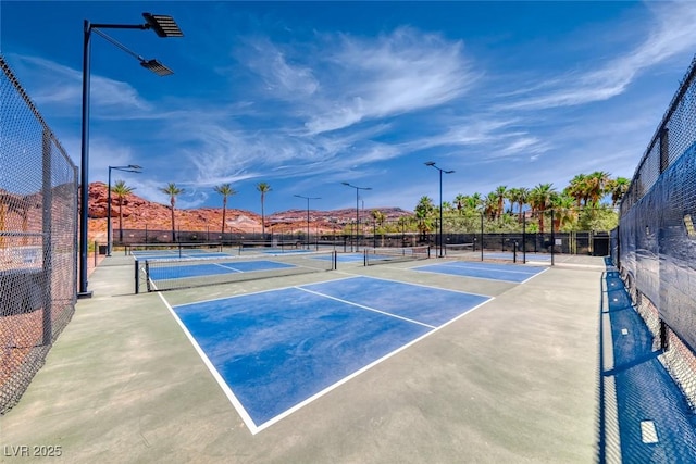 view of sport court with a mountain view