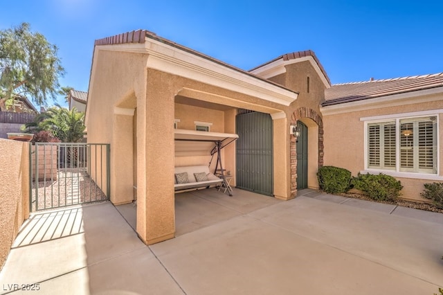 view of patio / terrace with a gate and fence