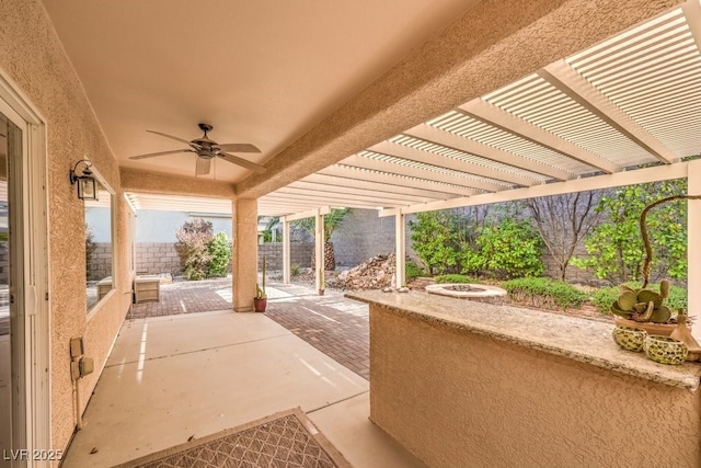 view of patio with ceiling fan, a fenced backyard, and a pergola