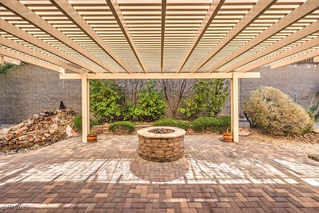 view of patio / terrace featuring a fire pit and a pergola