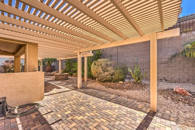 view of patio featuring fence and a pergola