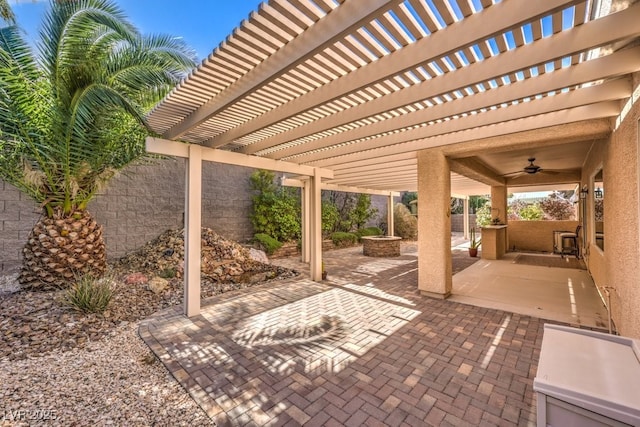 view of patio with a fenced backyard, a ceiling fan, and a pergola