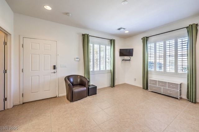 sitting room featuring baseboards, light tile patterned floors, visible vents, and recessed lighting