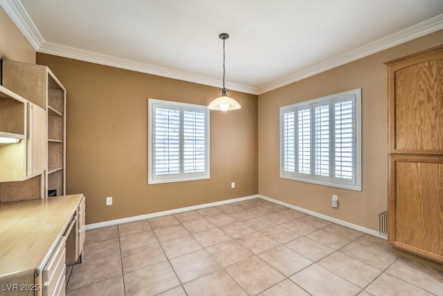 unfurnished dining area featuring light tile patterned floors, plenty of natural light, baseboards, and crown molding