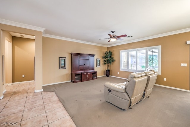 living area featuring ornamental molding, light colored carpet, baseboards, and light tile patterned flooring