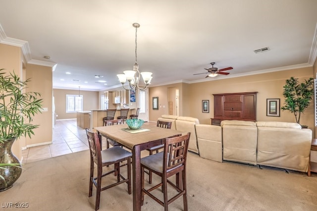 dining space with crown molding, light tile patterned floors, light colored carpet, visible vents, and baseboards