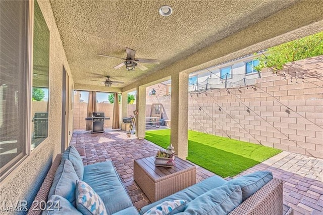 view of patio / terrace featuring ceiling fan, grilling area, and an outdoor hangout area