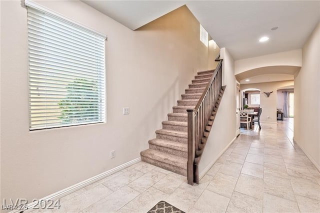 stairs featuring plenty of natural light