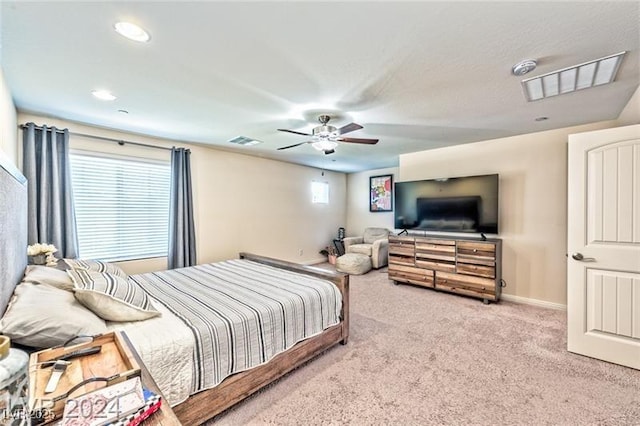 bedroom with light colored carpet and ceiling fan