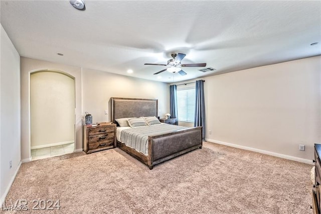 carpeted bedroom featuring ceiling fan