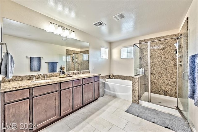 bathroom with vanity, plus walk in shower, and tile patterned flooring