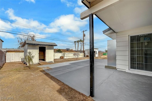 view of patio with a storage unit