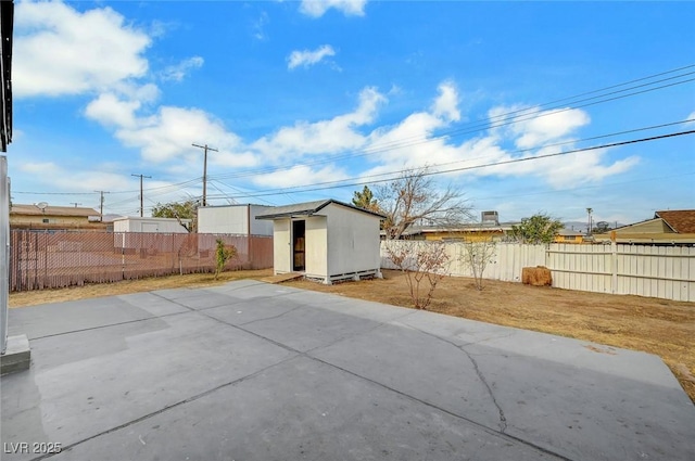 view of patio featuring a storage unit