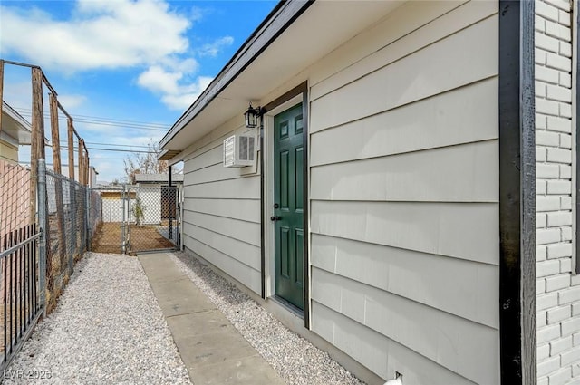 view of home's exterior with a wall mounted air conditioner