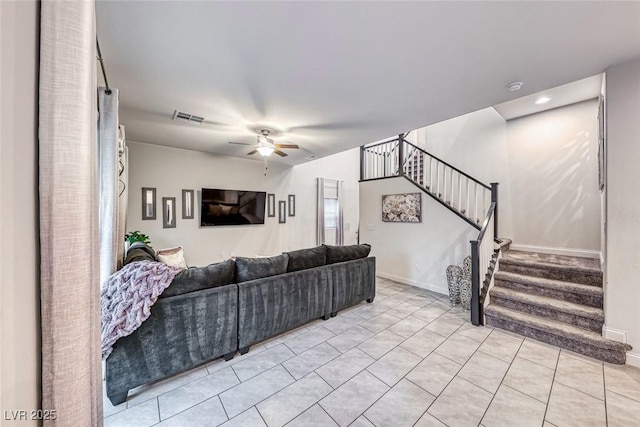 tiled living room featuring ceiling fan