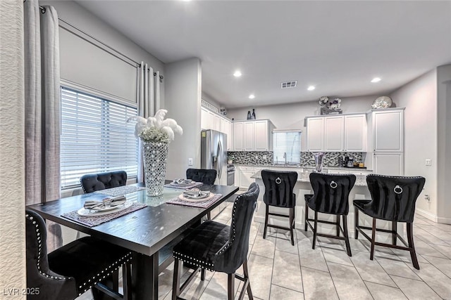 dining room featuring light tile patterned flooring