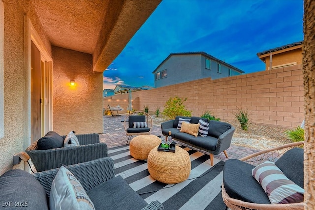 patio terrace at dusk with outdoor lounge area