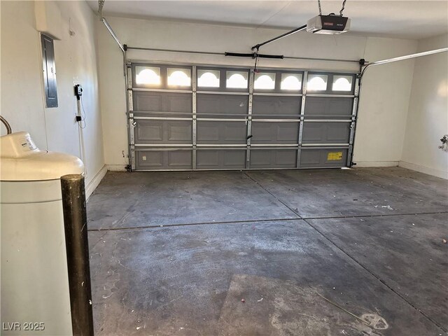 garage featuring a garage door opener and electric panel