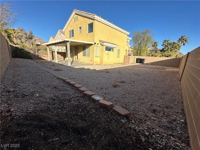 back of property featuring a patio area