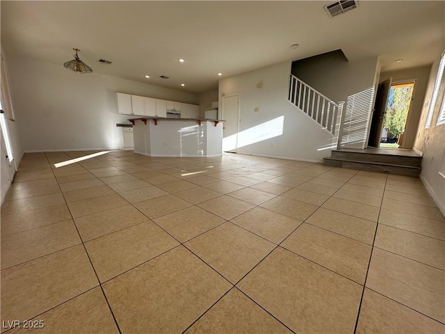 interior space featuring light tile patterned flooring