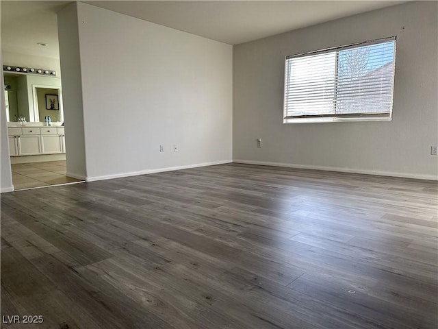 empty room with dark wood-type flooring