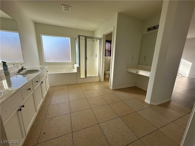 full bathroom featuring tile patterned flooring, vanity, separate shower and tub, and toilet