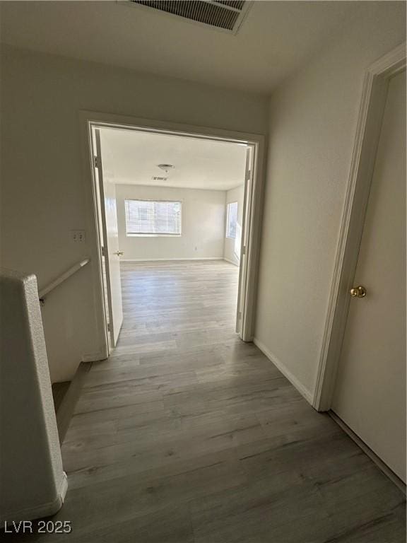 hallway with light wood-type flooring