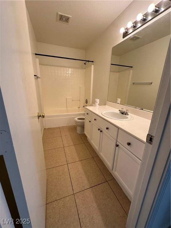 full bathroom featuring tile patterned flooring, vanity, shower / washtub combination, and toilet