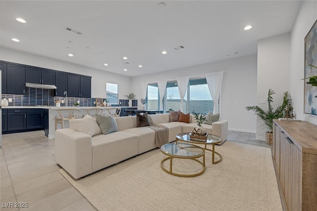 tiled living room with a wealth of natural light