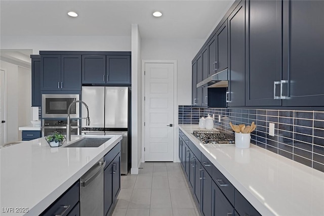 kitchen featuring tasteful backsplash, sink, light tile patterned flooring, and appliances with stainless steel finishes