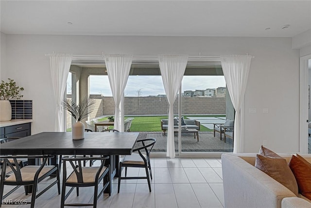 dining space with light tile patterned flooring