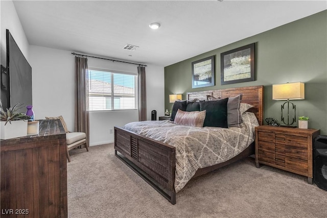 bedroom with carpet floors, baseboards, and visible vents