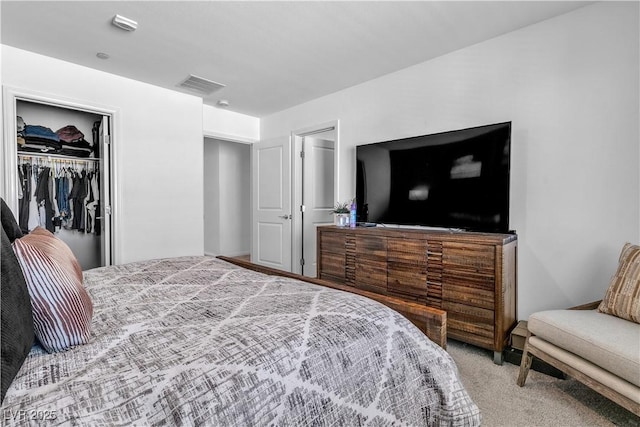 bedroom featuring a closet, visible vents, and carpet flooring