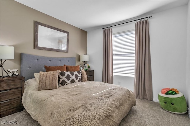 bedroom with carpet floors and multiple windows