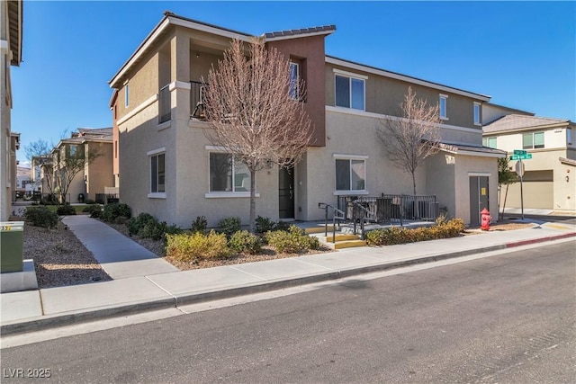 view of front of house featuring stucco siding