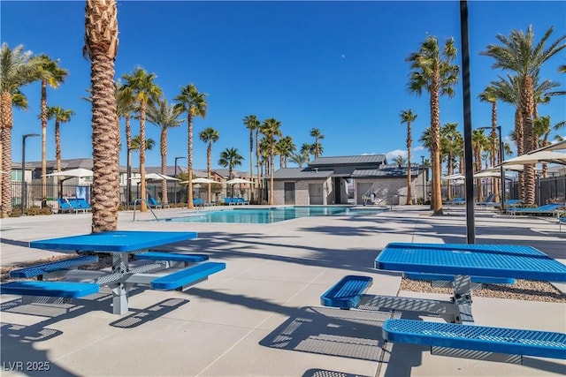 pool featuring a residential view, fence, and a patio