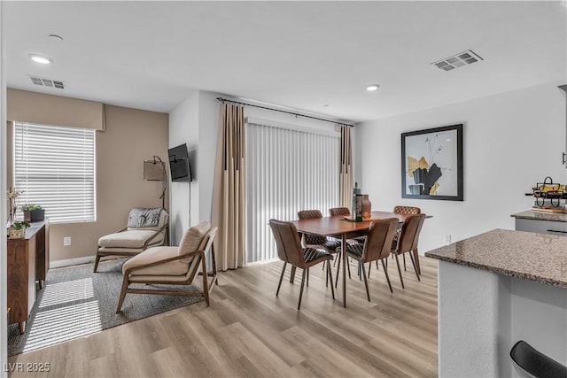 dining area featuring recessed lighting, visible vents, and light wood-style floors