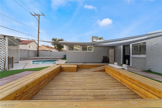 wooden terrace with a fenced in pool