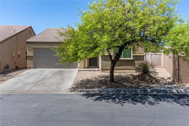 view of property hidden behind natural elements featuring a garage