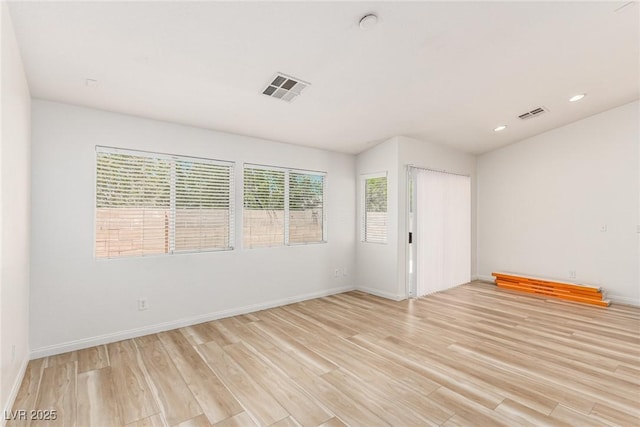 unfurnished room with light hardwood / wood-style floors