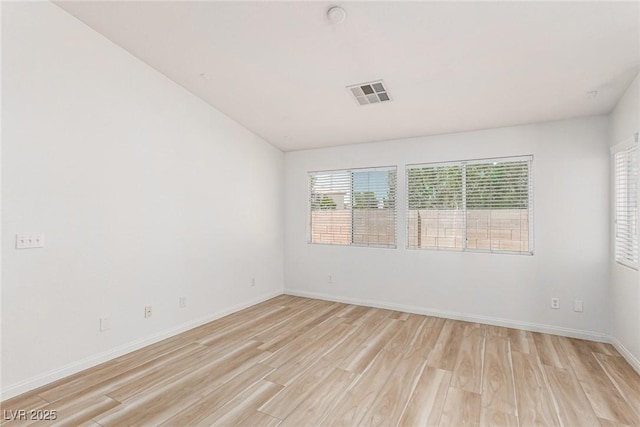 unfurnished room featuring light wood-type flooring