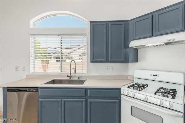 kitchen featuring sink, dishwasher, white range with gas stovetop, and blue cabinetry