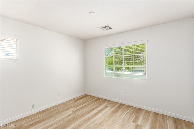 unfurnished room featuring light wood-type flooring