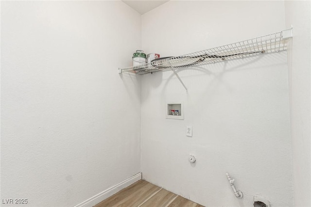 laundry area with hookup for a gas dryer, hookup for a washing machine, and hardwood / wood-style floors